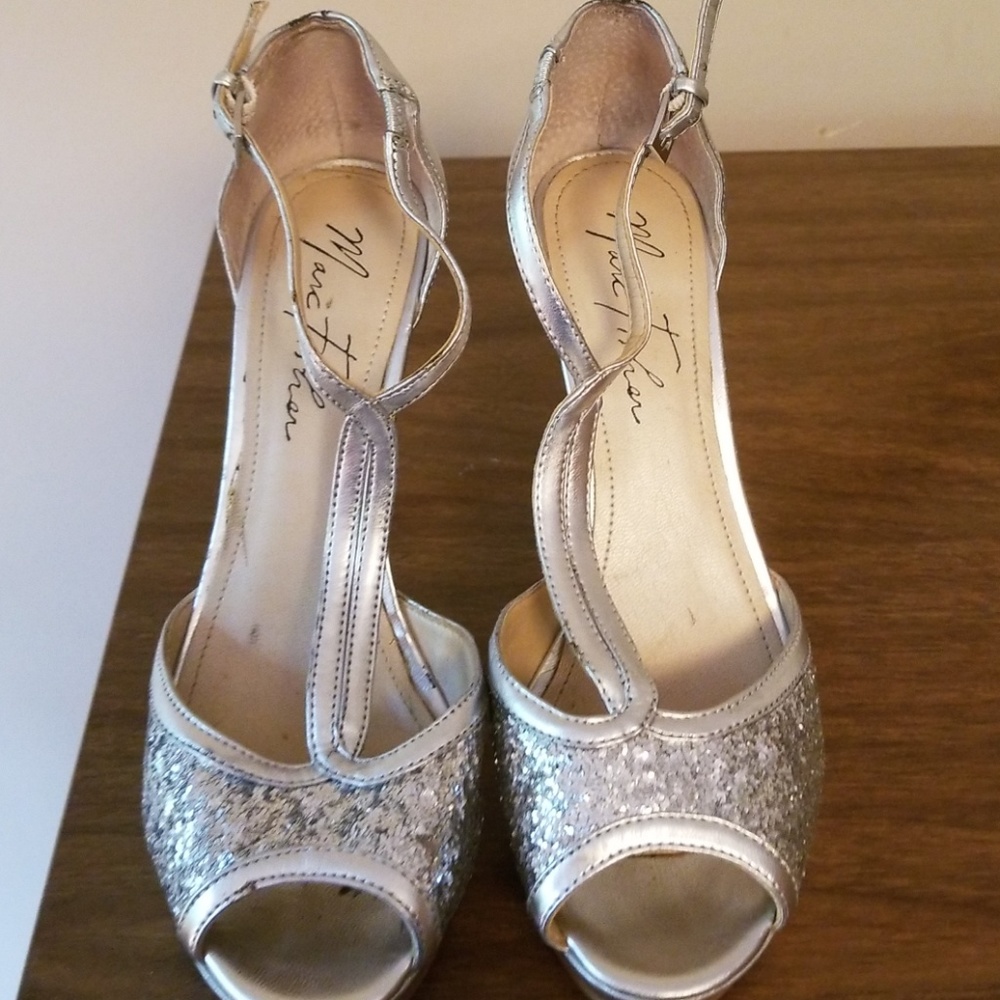 Silver Marc Fisher evening platform pumps.